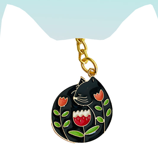 Blooming Catnap: Enamel Black Kitty Keychain with Floral Accents